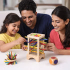 Kids wooden tower game with color-coded dice for strategy play